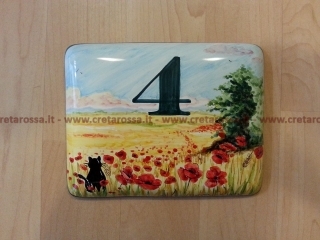 cod.art: nc80 - Mattonella in ceramica leggermente bombata cm 17x13 circa con 1 gatto e papaveri e scritta personalizzata. 